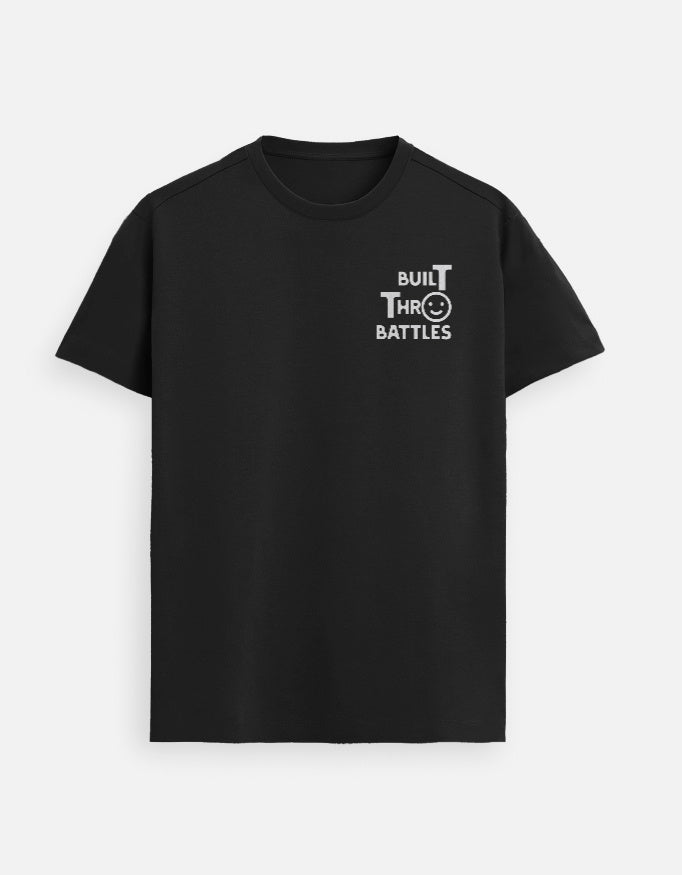 “Built Thro Battles Unisex FeatherLite T-Shirt in Black – Premium Supima Cotton Christian tee with resilience message, soft and breathable, crafted in India by StyleYourFaith.”